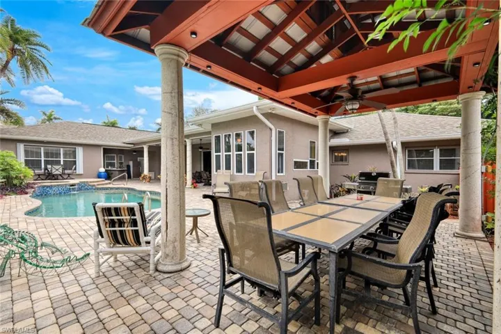 View of swimming pool featuring grilling area, a patio, ceiling fan, and a gazebo
