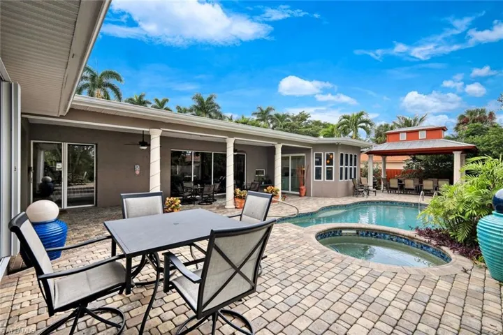 View of pool with an in ground hot tub, a patio, and a gazebo