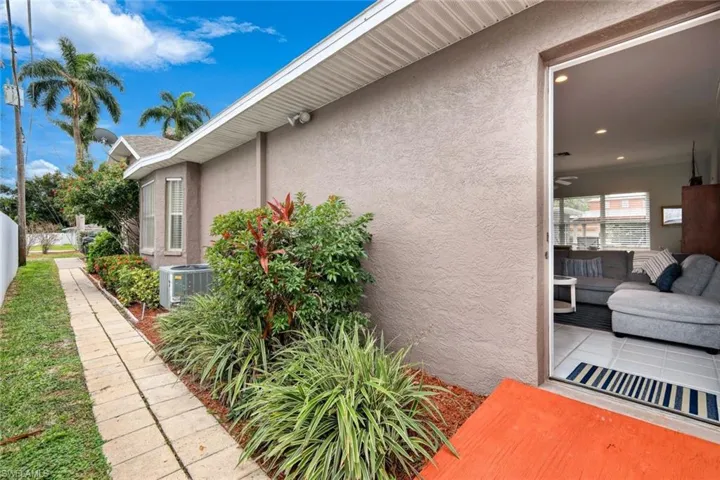 View of property exterior featuring cooling unit and a patio area