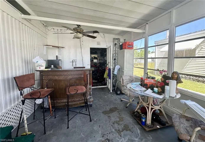 Breezeway with storage and laundry room through the door.