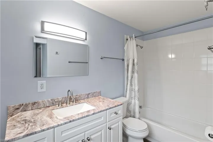 Master Bath with tub shower combination and large vanity.  Beautiful granite vanity also!