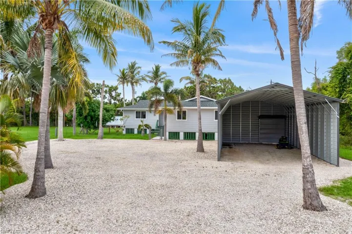 Front of house with huge  open garage