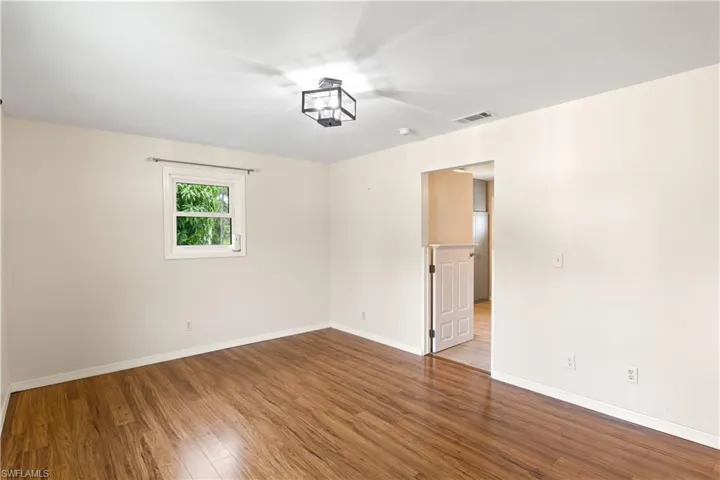 Dining room with kitchen access - pony wall is another charming addition.
