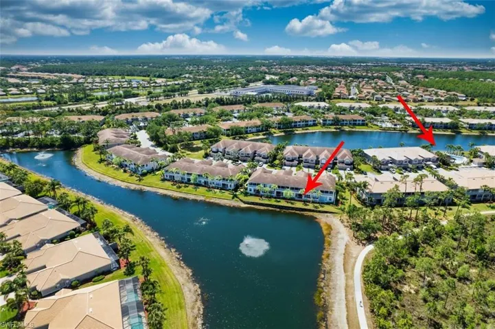Aerial perspective of suburban area with a large body of water