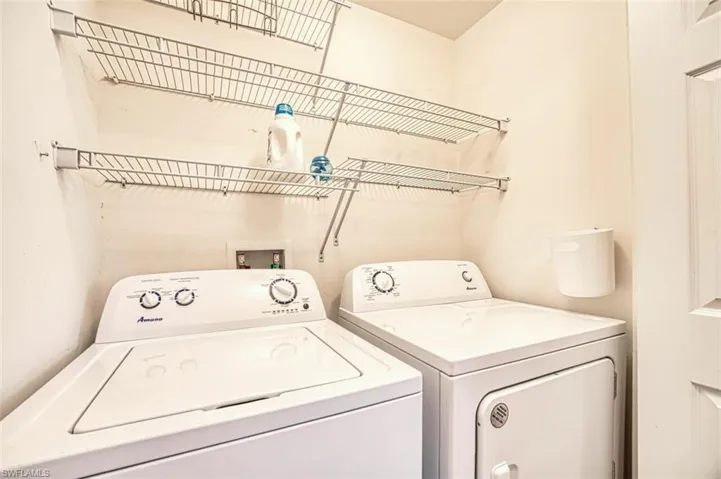 Laundry area featuring washer and clothes dryer