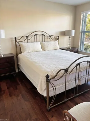 Bedroom featuring dark wood-type flooring