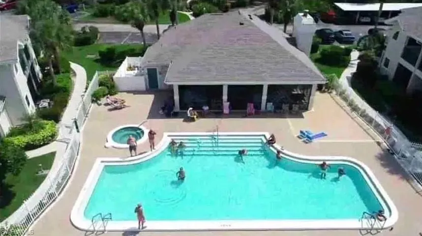 Community pool with a patio area