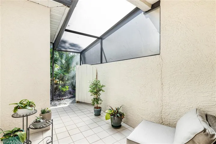View of patio / terrace featuring a sunroom