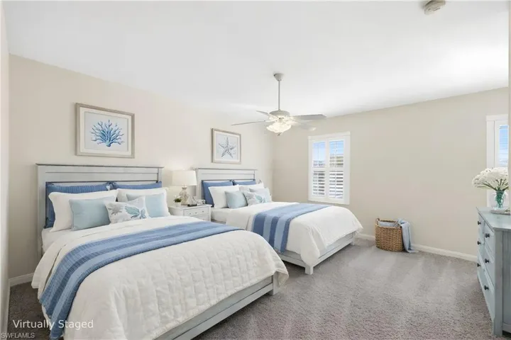 Virtually Staged Bedroom 2 on the second fllor with two Queen Beds
