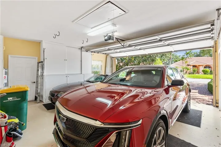 Garage featuring a carport and a garage door opener