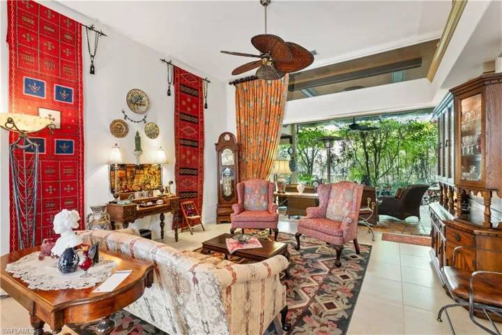 Tiled living room featuring ceiling fan