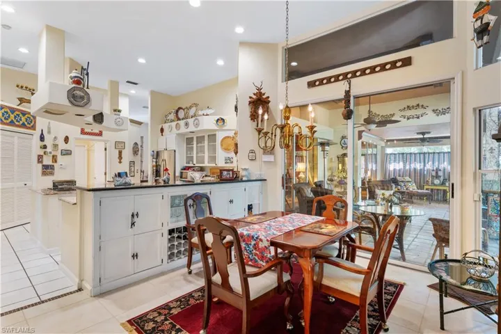 Dining room with ceiling fan and light tile flooring