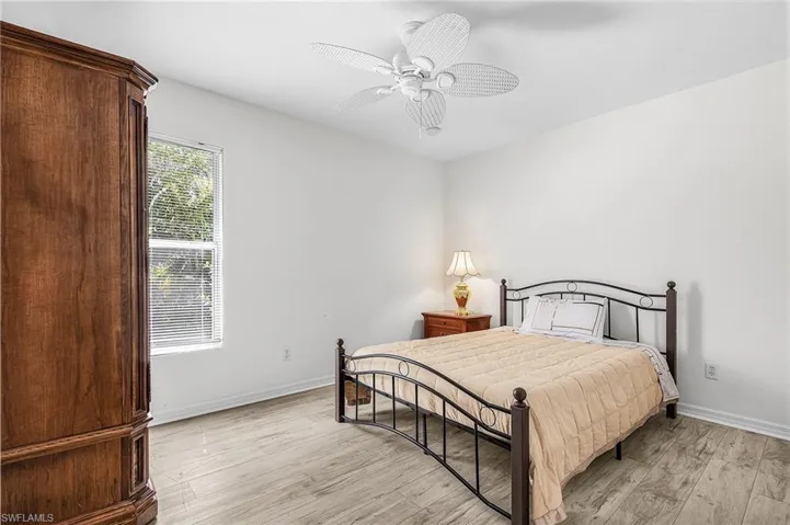 Bedroom featuring light wood-style flooring and ceiling fan