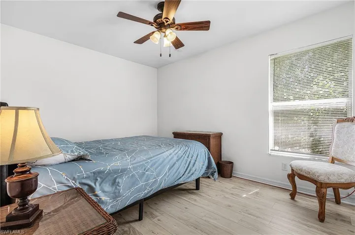 Bedroom featuring wood finished floors and ceiling fan