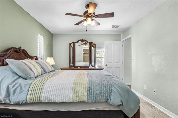 Bedroom featuring wood finished floors, and ceiling fan