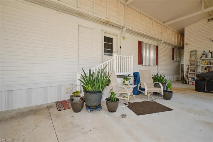 Home entrance under RV carport