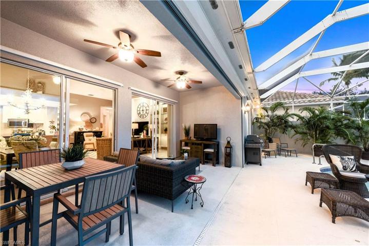 Twilight Shot Of The Furnished Covered Lanai. You Can Eat Your Dinners And Breakfasts Outside With These Amazing Views!