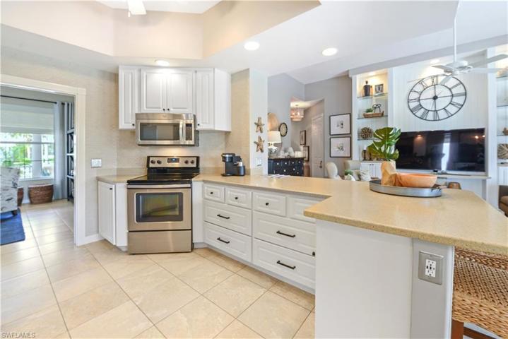 The Kitchen Comes With Stainless Steel Appliances, Tile Backsplash, Solid Surface Countertops, Custom White Cabinets And Drawers With New Pulls, A Breakfast Bar That Seats Five Comfortably, And A Ceiling To Floor Pantry!