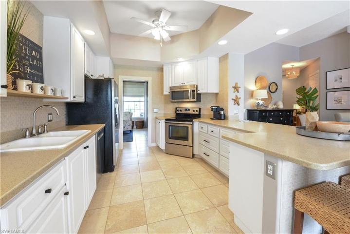 The Kitchen Comes With Stainless Steel Appliances, Tile Backsplash, Solid Surface Countertops, Custom White Cabinets And Drawers With New Pulls, A Breakfast Bar That Seats Five Comfortably, And A Ceiling To Floor Pantry!