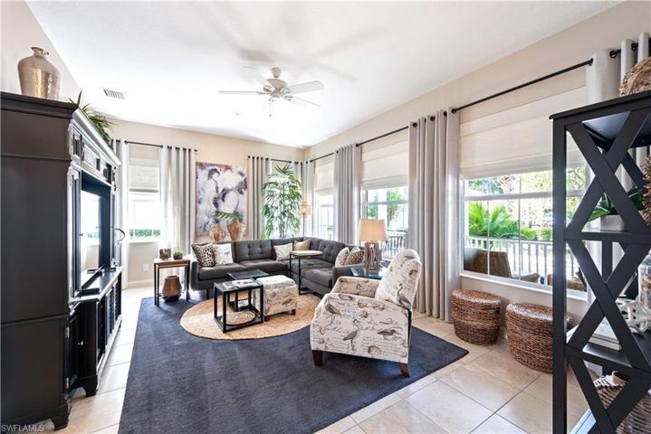 The Formal Living Room Has Plenty Of Windows And Natural Light! Tastefully Furnished And Ready To Entertain!