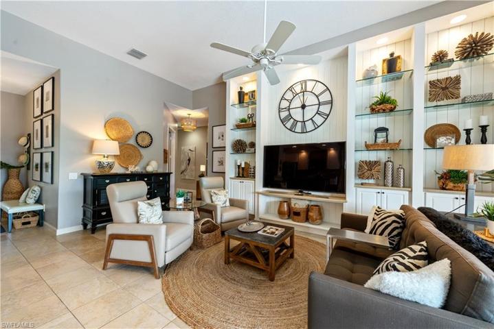 The Living Room Received An Amazing Upgrade By Adding The Shiplap And Glass Shelving Into The Built-In Entertainment Center! This Home Is Move-Ready For Your Family Or Rental Clients!