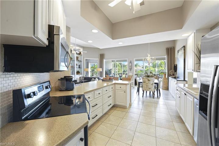The Kitchen Comes With Stainless Steel Appliances, Tile Backsplash, Solid Surface Countertops, Custom White Cabinets And Drawers With New Pulls, A Breakfast Bar That Seats Five Comfortably, And A Ceiling To Floor Pantry!