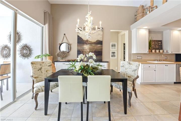 The Dining Area Comes With Double Glass Sliders And A Great View, Along With A Coral Chandelier, Extra Storage Cabinets, And A Dining Table That Seats Six People!