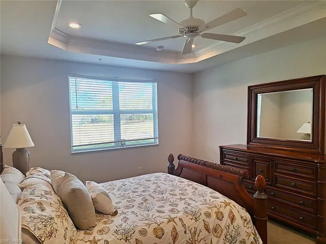 Bedroom featuring ornamental molding, a ceiling fan, and recessed lighting
