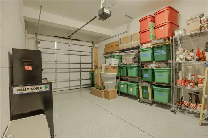Garage featuring a garage door opener