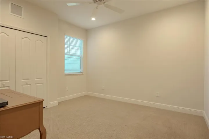 Unfurnished office featuring light colored carpet, recessed lighting, and ceiling fan