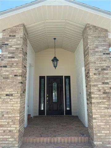 Property entrance with stucco siding