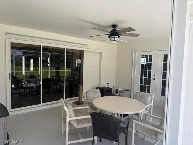 View of patio with french doors and a ceiling fan