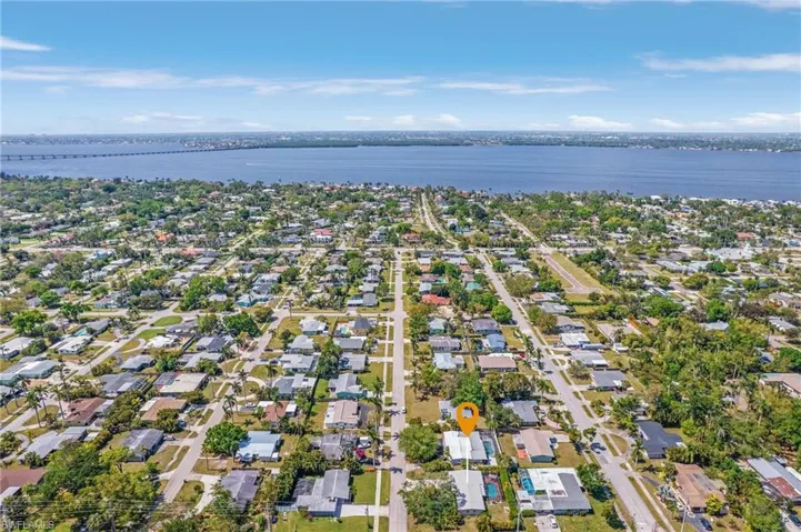 Birds eye view of property featuring a residential view and a water view
