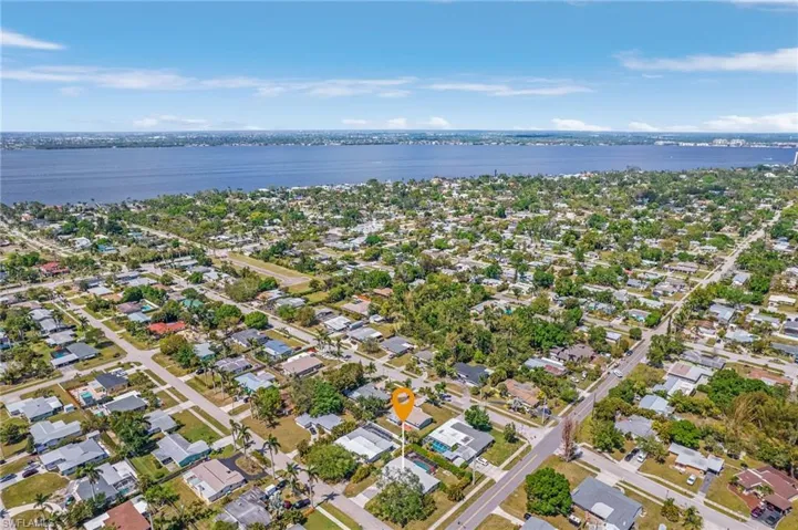Bird's eye view featuring a water view and a residential view