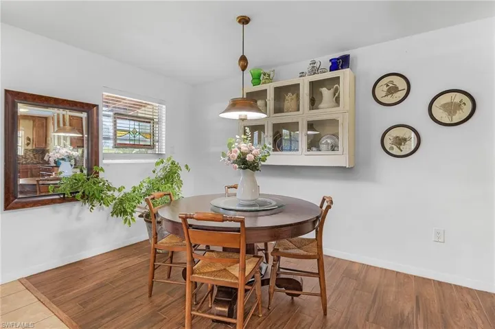 Dining room with wood finished floors and baseboards