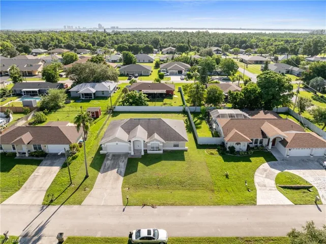 Aerial view of residential area with a tree filled landscape