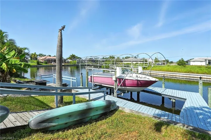 Dock with boat lift, captains walk and a water view