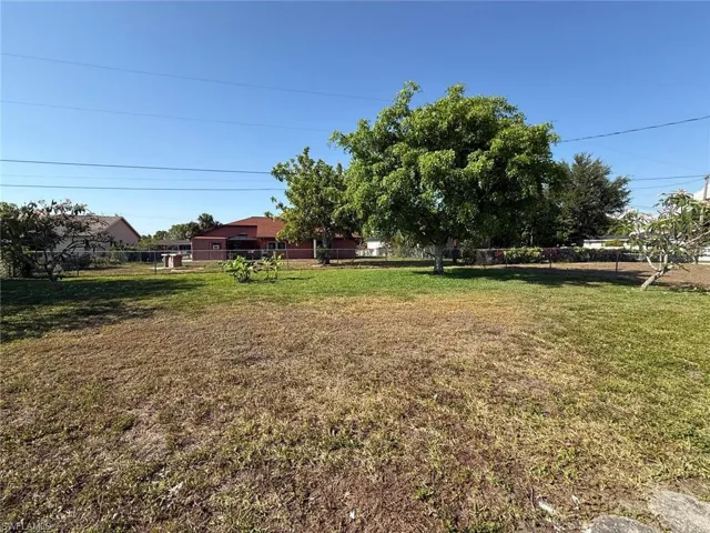 View of yard featuring fence