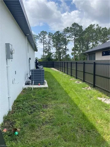 View of yard with central air condition unit