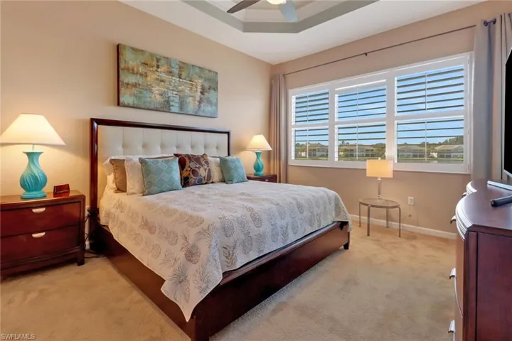 Bedroom featuring ceiling fan and carpet flooring
