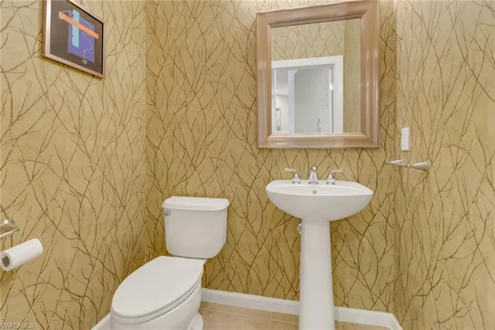 Bathroom with tile patterned flooring and toilet