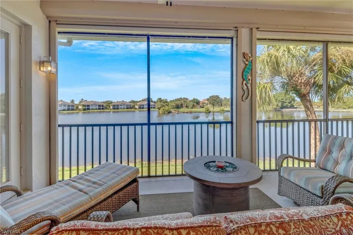 Sunroom with a water view