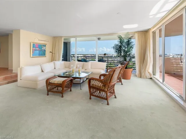 Large step down living room with abundant natural light on 2 sides
