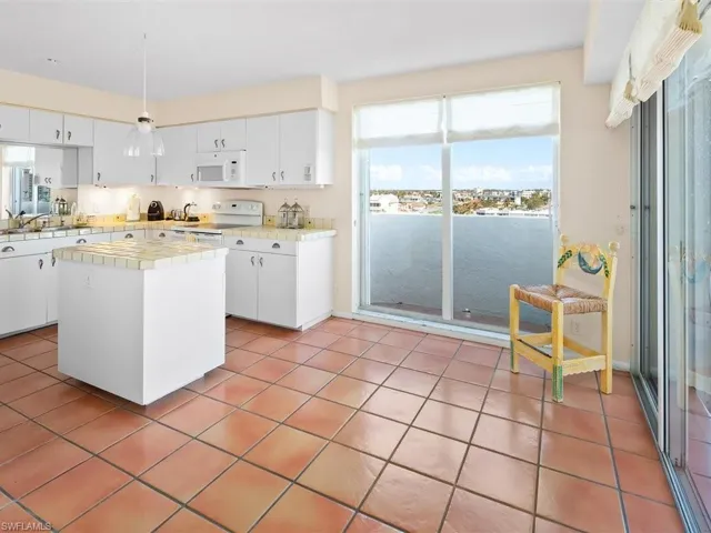 Spacious kitchen with sliding door for gentle breezes and private balcony