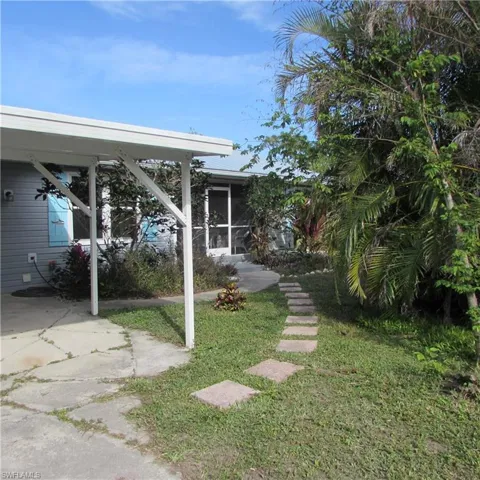 View of yard with a sunroom