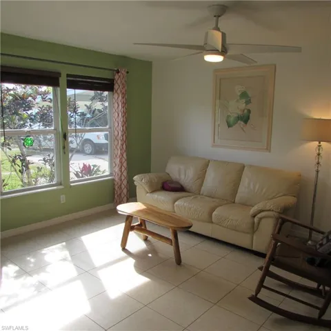 Tiled living room with ceiling fan
