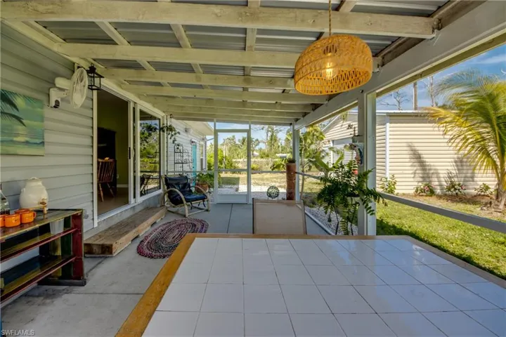 Sunroom featuring plenty of natural light and vaulted ceiling
