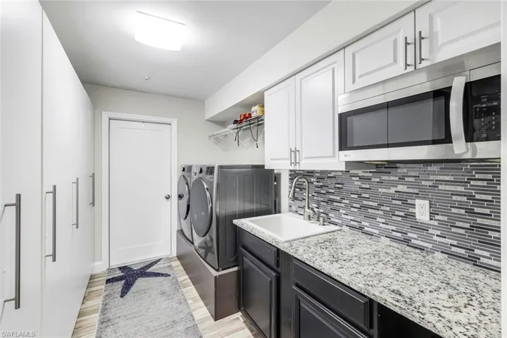 Fabulous laundry room with plenty of storage!