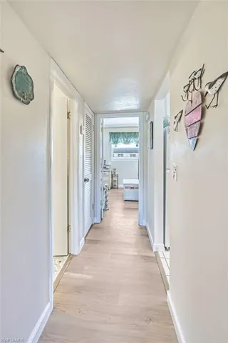 Hallway view to primary bedroom