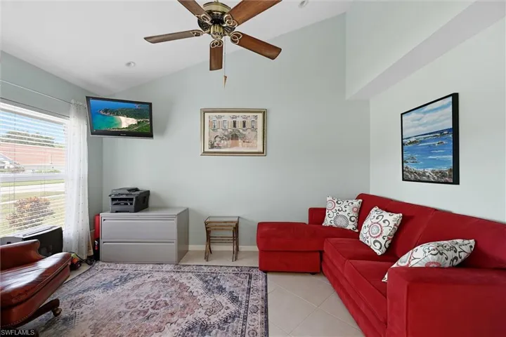 Vaulted ceiling with recessed lighting and ceiling fan